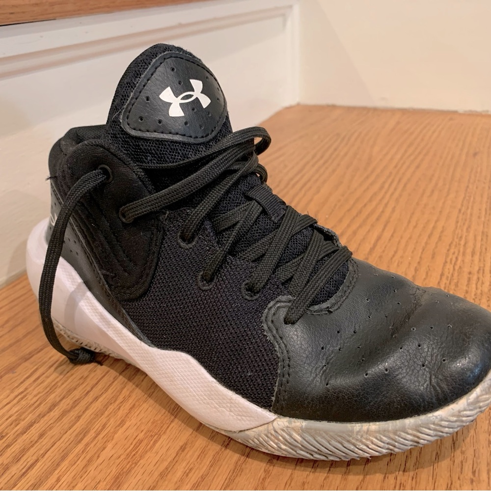 Size 3Y pair of black Under Armour basketball shoes.